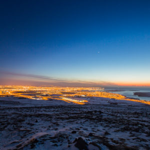 Long exposure of Reykjavík from a nearby hill top at night