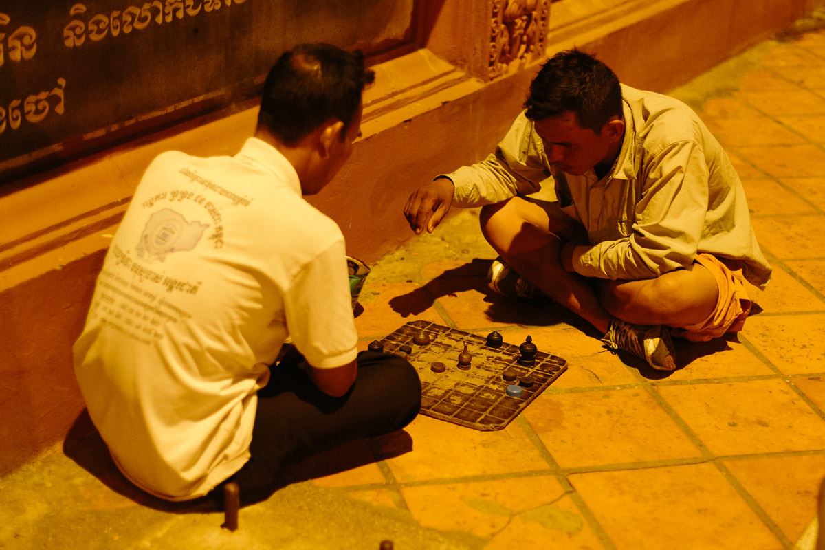 Locals playing chess on the streets of Phon Phen