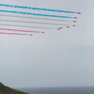 The Red Arrows fly out from Fowey Harbour